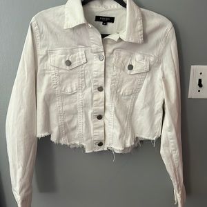 “C’est TIO black label” white jean jacket with 2 pockets some ripped designs.